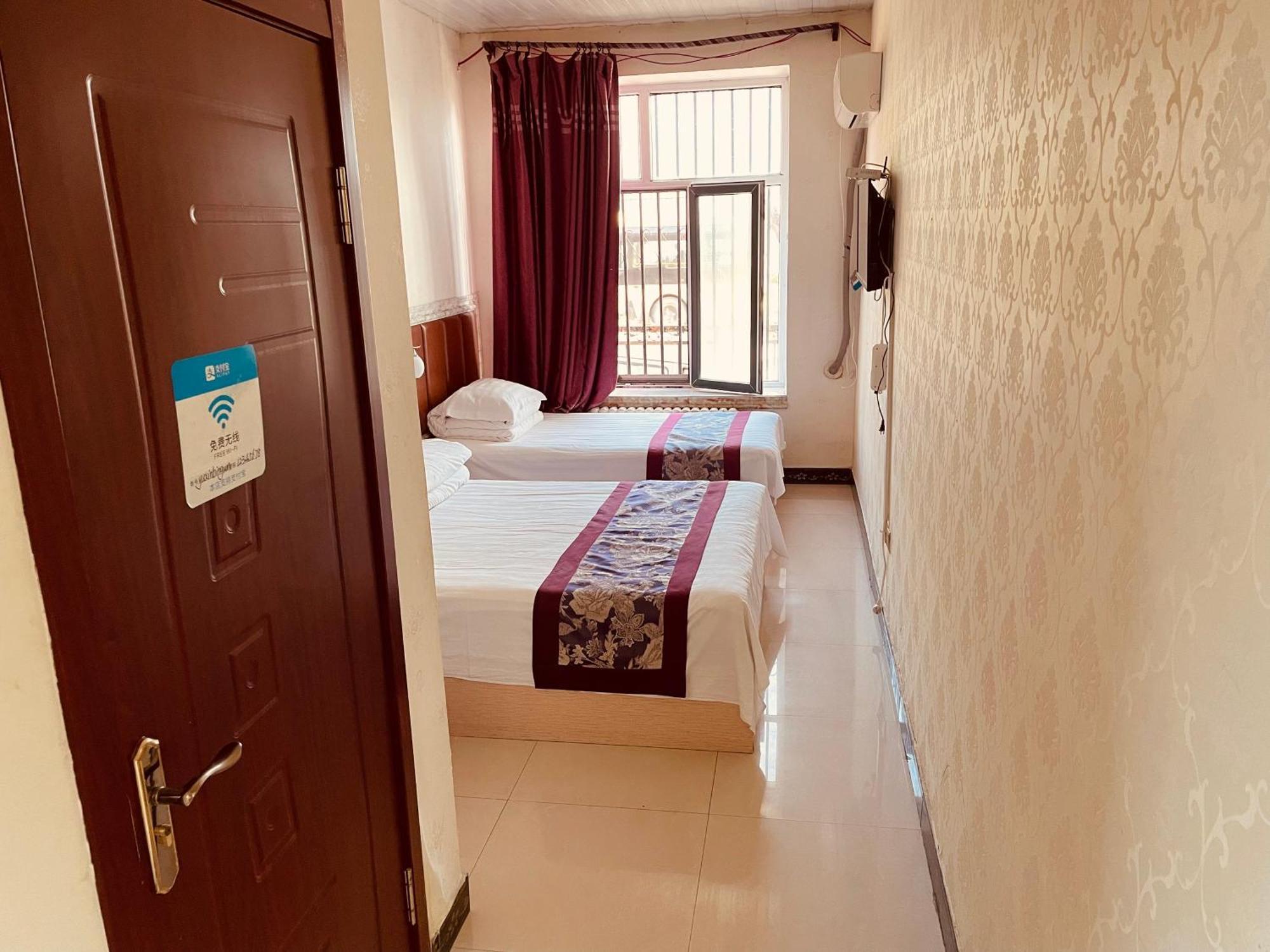 哈尔滨机场东方红运宾馆 Hotel Værelse billede